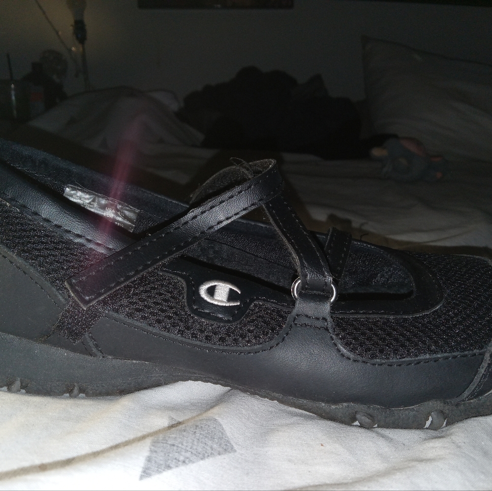 pair of champion , black watershoes ,
